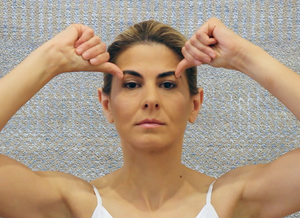 How to Perform Facial Yoga to Lift and Brighten Your Eyes